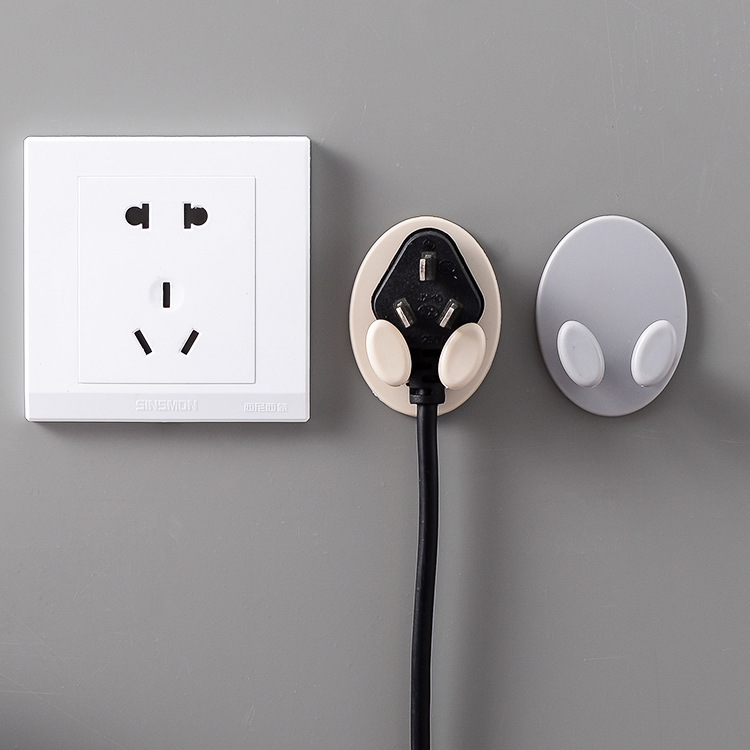 Household no-drill oval plug hook, seamless adhesive wall-mounted power cord organizer