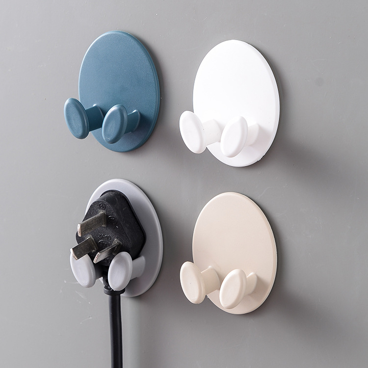 Household no-drill oval plug hook, seamless adhesive wall-mounted power cord organizer
