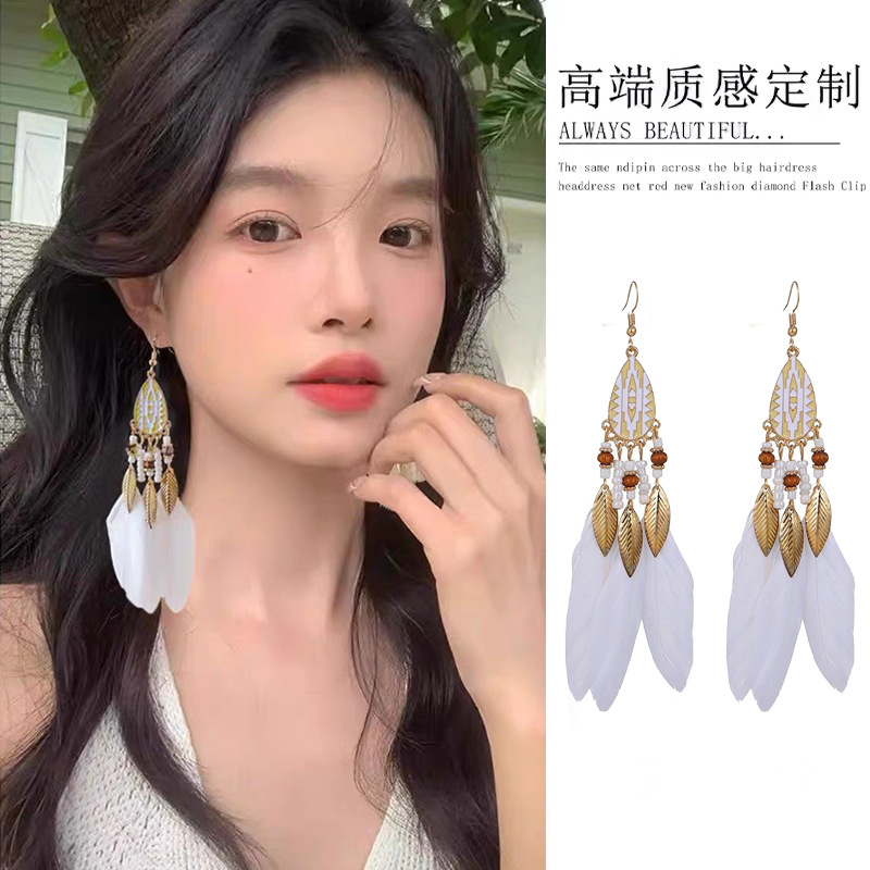 Ethnic style red bead tassel Bohemian earrings Yunnan travel resort style ear cuff feather ear accessories