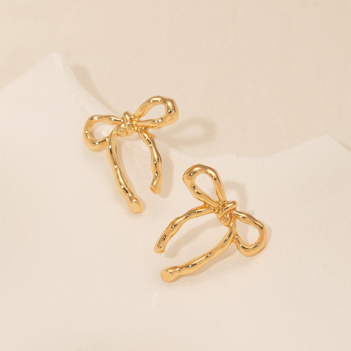 Gold bow ear studs for women minimalist smooth surface earrings