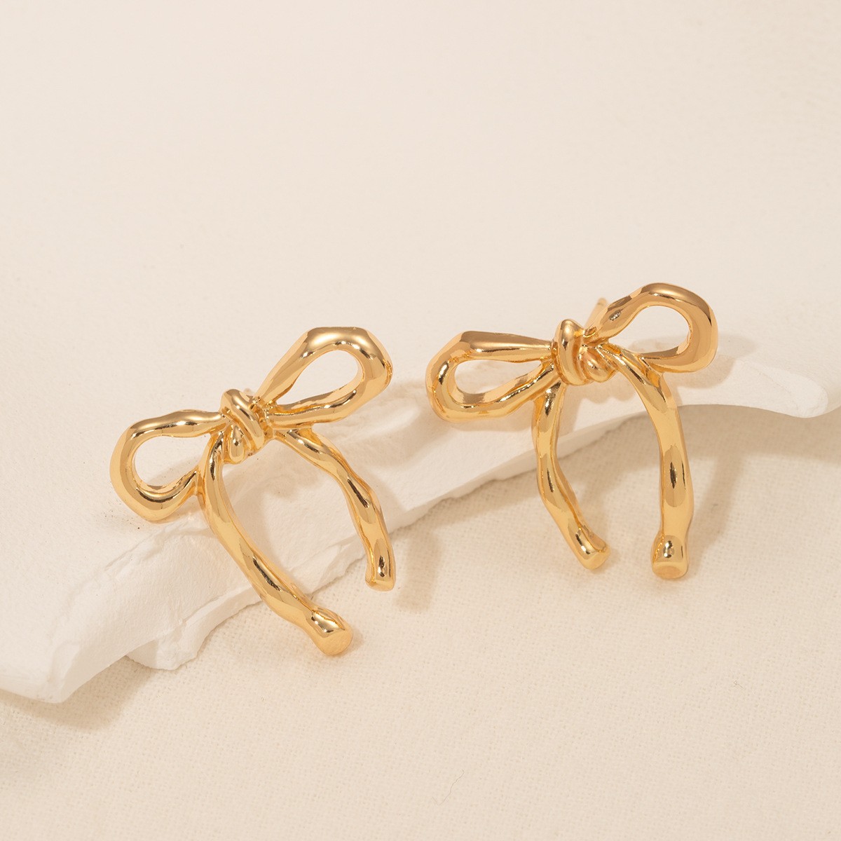 Gold bow ear studs for women minimalist smooth surface earrings
