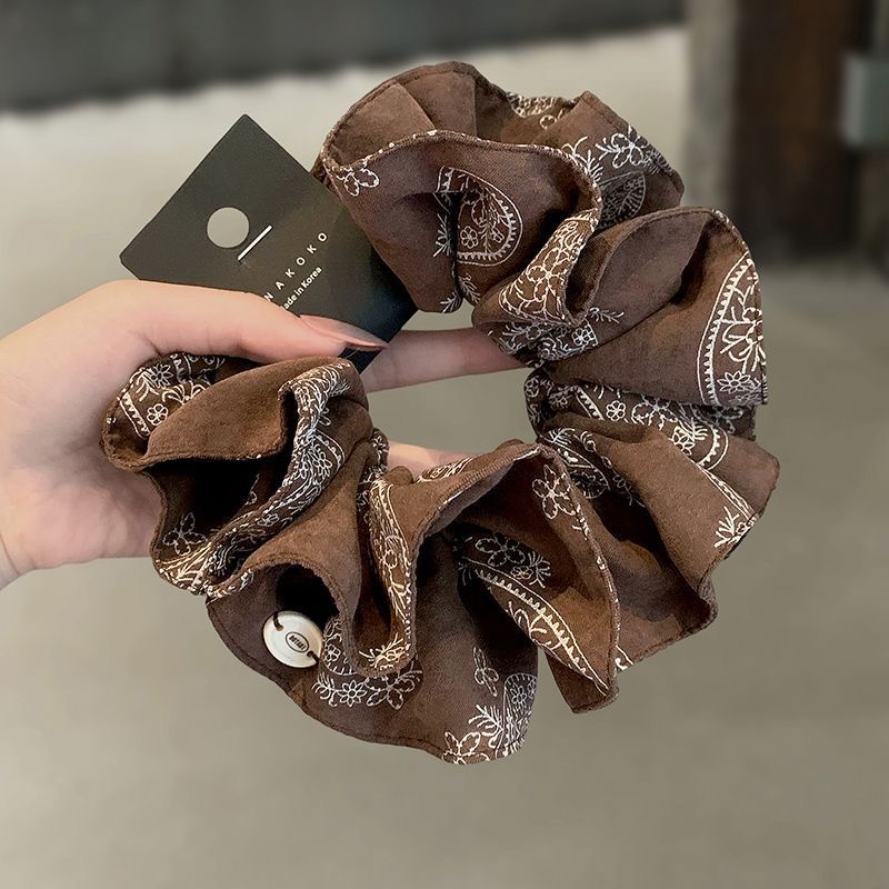 96#咖色腰果花图案米色椭圆标约14cm