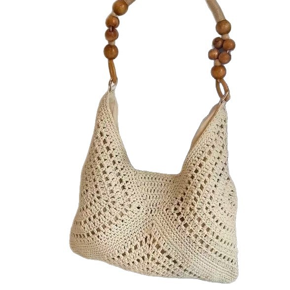 Summer seaside beach bag women's 2026 new large capacity hollow woven shoulder bag handbag tote bucket bag