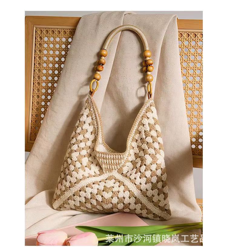 Summer seaside beach bag women's 2026 new large capacity hollow woven shoulder bag handbag tote bucket bag